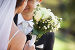 Mid section of a newlywed couple with bouquet in park, фото № 6123835, снято 21 ноября 2013 г. (c) Wavebreak Media / Фотобанк Лори