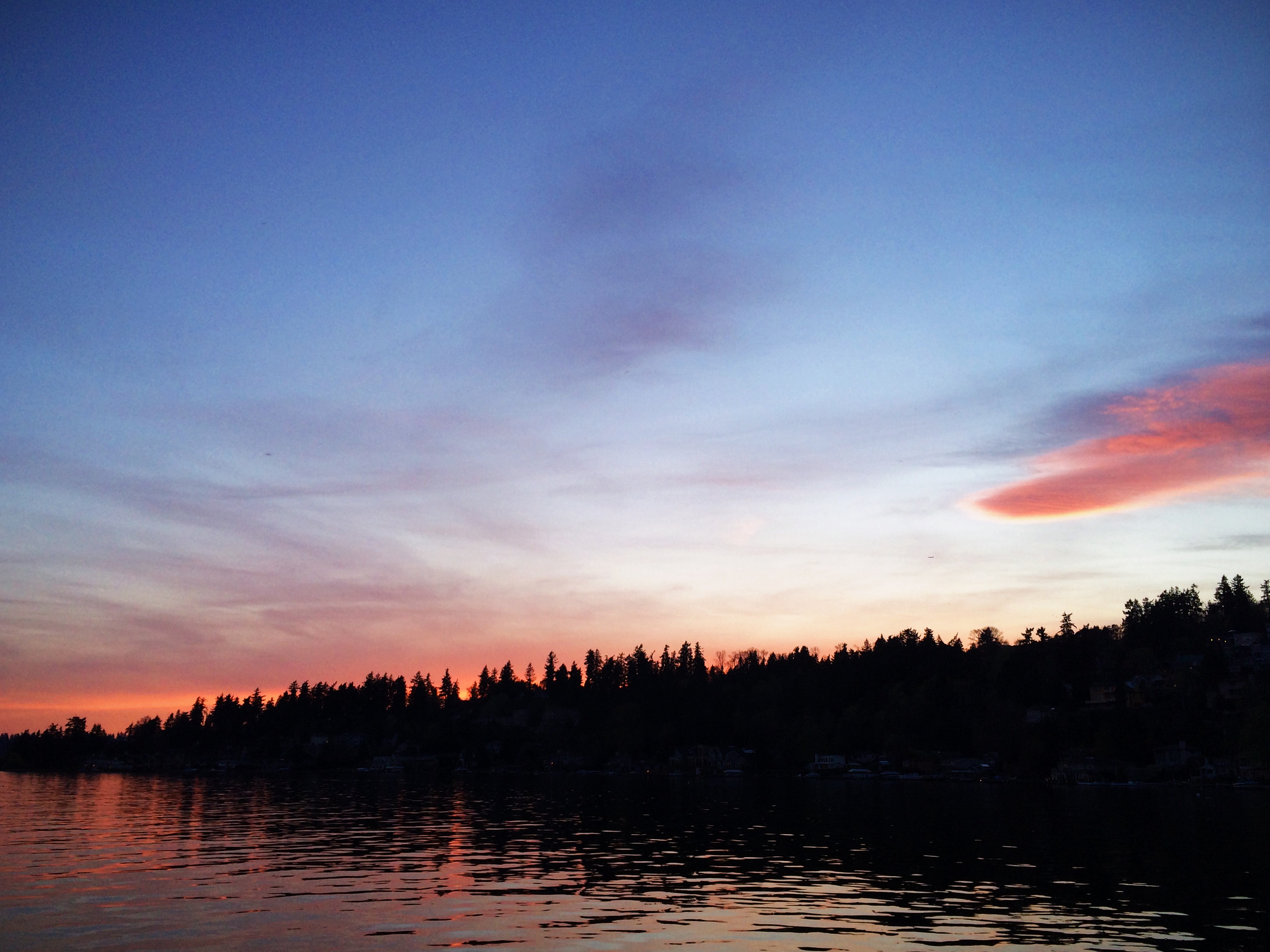 A beautiful sunset as seen from Juanita Beach Park in Kirkland, Washington.