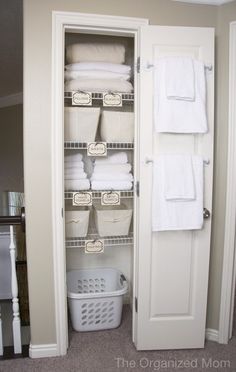 Guest room closet- like the idea of a laundry basket in there for guests to put their dirty linens in and towel bars on the inside of the door @ Do it Yourself Home Ideas