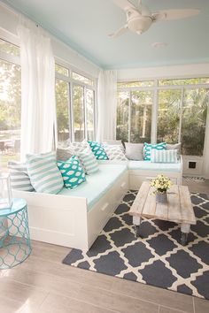 2 Ikea daybeds in a Sunroom used as sofas by day, or  for guests and family sleep spots at night. -----guest room