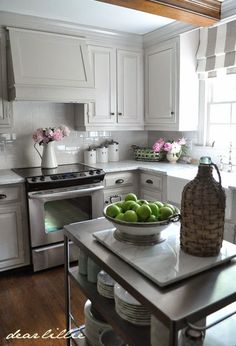 Our Kitchen Makeover (Before and Afters and a Full Source List) by Dear Lillie~range hood-custom built.