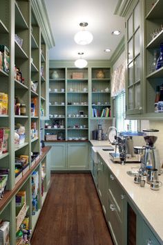 Nice mix of open shelving and cabinetry via 10 Kitchen Pantry Ideas for Your Home - Town & Country Living