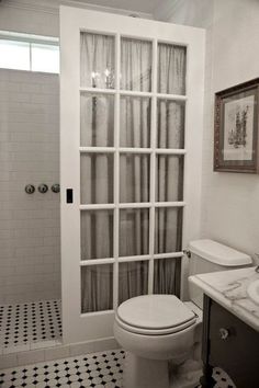 old french pocket door used instead of an expensive glass shower enclosure. @ Home DIY Remodeling