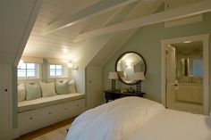 Attic converted into a gorgeous bedroom & bath! Open beams, soft colors, window bench make this room so appealing. Great use of normally wasted space.