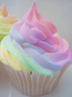 Rainbow Cupcake- my cousin told me how to do this, get 4 seal bags put icing in them and then put the bags in a pipeing bag then squish them out also use cream instead of milk it makes it so much yummier :)