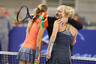 Belarusian President Alexander Lukashenko embraces Denmark's tennis star Caroline Wozniacki, right, and Belarus' Victoria Azarenka during charitable tennis match in Minsk, Belarus, Friday, Nov. 19, 2010. 