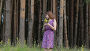 Sexy woman picking wild flowers, видеоролик № 25056262, снято 3 августа 2016 г. (c) Roman Larchikov / Фотобанк Лори