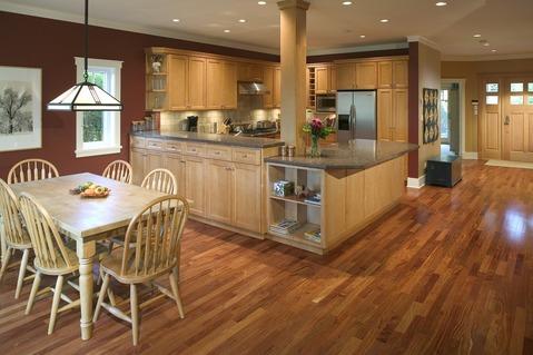 Traditional Dining Room with dark brown painted wall