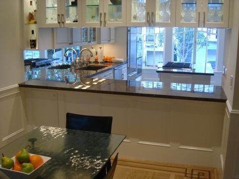 Transitional Dining Room with white wood kitchen cabinets