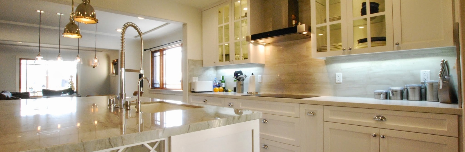 Transitional Kitchen with polished chrome pendant lights