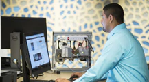 An intern working at his desk in office