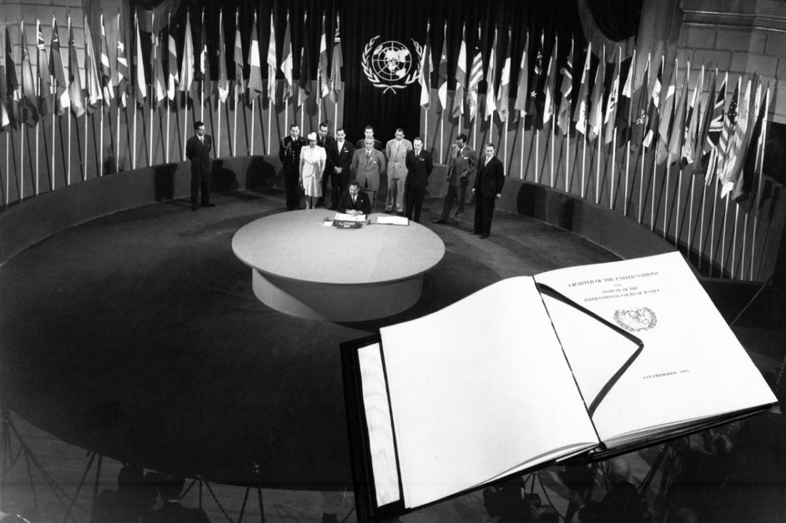 The United Nations Conference on International Organization, San Francisco, 1945.  A facsimile copy of the Charter is superimposed on the photo.