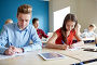 Купить «group of students with books writing school test», фото № 23434135, снято 22 апреля 2016 г. (c) Syda Productions / Фотобанк Лори