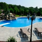 Swimming Pool with Diving Board and Waterfall