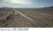 Купить «Highway with moving SUV car in Death Valley in USA», видеоролик № 29164694, снято 25 сентября 2018 г. (c) Andriy Bezuglov / Фотобанк Лори