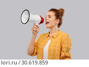 Купить «red haired teenage girl speaking to megaphone», фото № 30619859, снято 28 февраля 2019 г. (c) Syda Productions / Фотобанк Лори