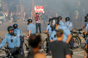 People gather near the Minneapolis Police third precinct after a white police officer was caught on a bystander's video pressing his knee into the neck of African-American man George Floyd, who later died at a hospital, in Minneapolis, Minnesota, U.S. May 27, 2020. REUTERS/Eric Miller - RC2EXG9954GA