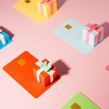 Multicolored, stylized credit cards and gift-wrapped presents