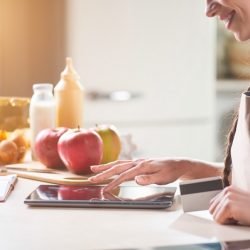 Smiling woman using tablet