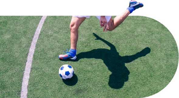 Soccer player kicking a ball