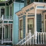 Colorful Victorian style homes with white and green painted trim