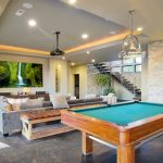 A newly remodeled basement with a pool table