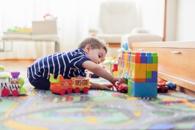 child playing in playroom