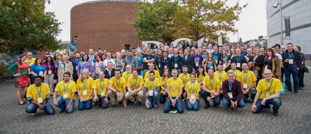 A group around 100 people who attended the WordCamp Dublin 2019 standing together.