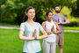 group of people doing yoga at summer park. Стоковое фото, фотограф Syda Productions / Фотобанк Лори