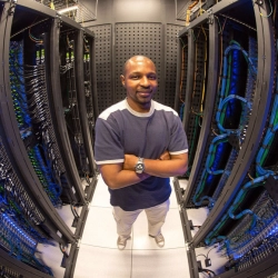 Man in front of computer servers