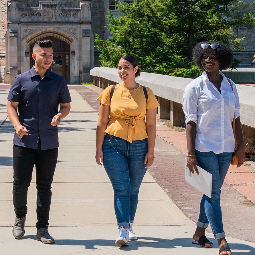 Student walking on the Lehman College campus.