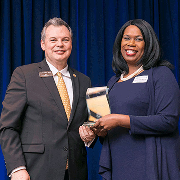 Student receiving award