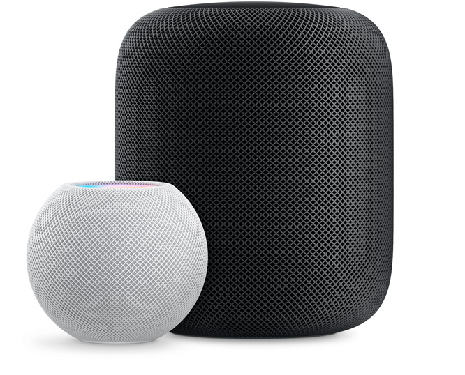 White HomePod mini in front and  to the left of a Space Gray HomePod.