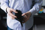 Man holding an empty wallet. Стоковое фото, агентство Ingram Publishing / Фотобанк Лори