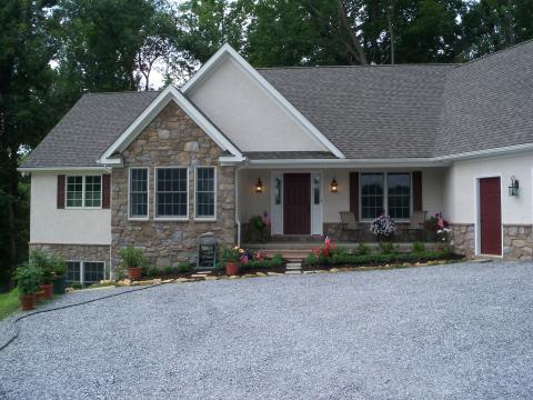 Home with a gravel driveway