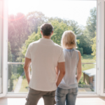 couple looking out window