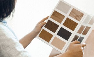 woman reviews types of flooring materials