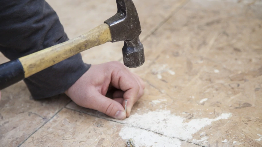 construction work with hammer and nail