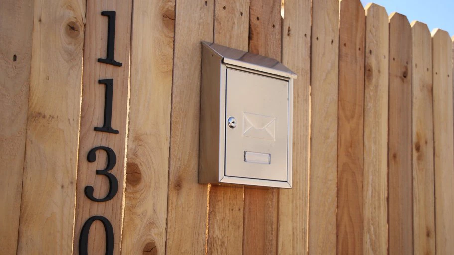 New wooden fence with mailbox