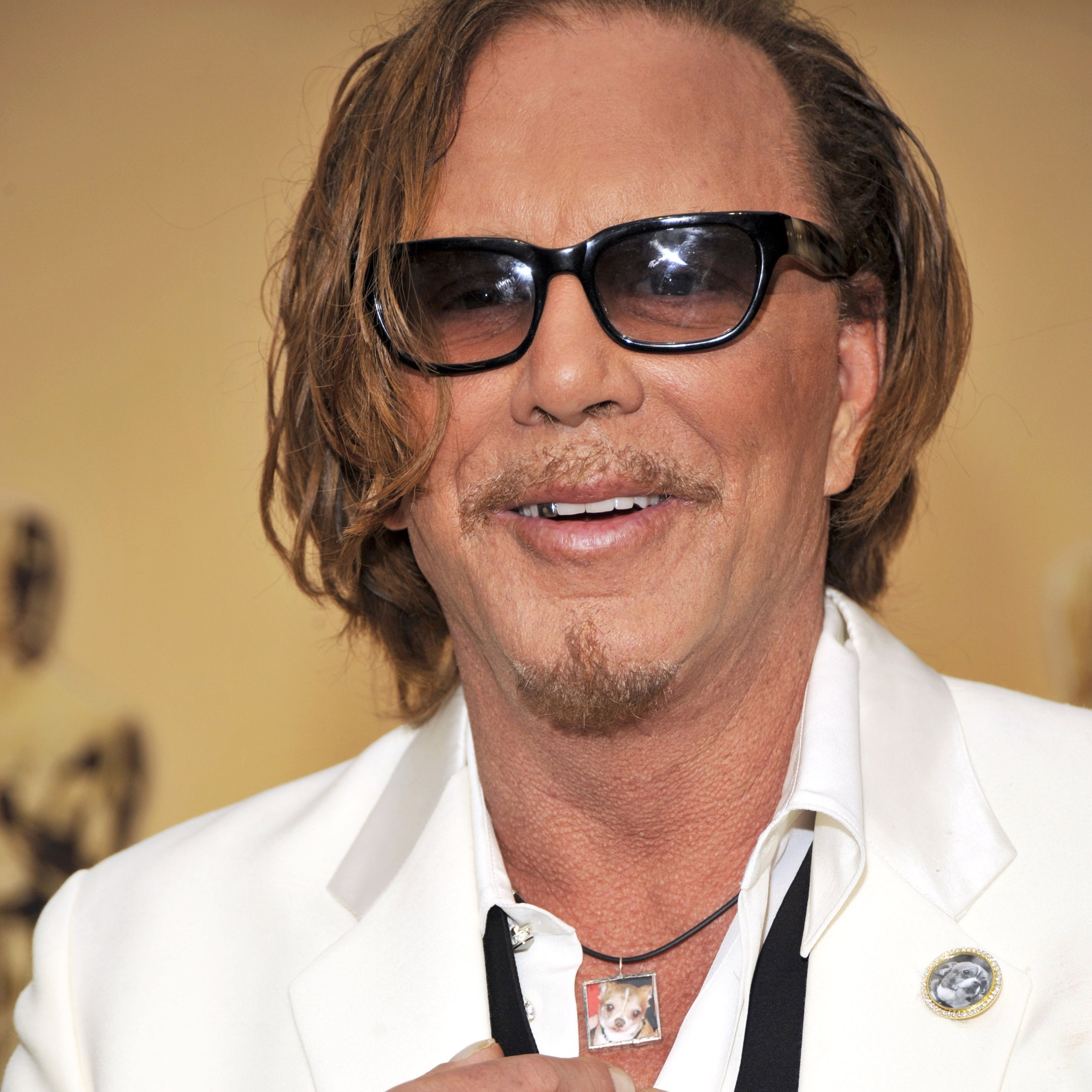 Image may contain Human Person Clothing Apparel Sunglasses Accessories Accessory Mickey Rourke Coat and Shirt