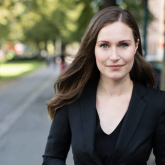 A portrait of Finnish Prime Minister, Sanna Marin, pictured outside.