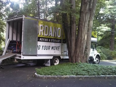 Movers load a moving truck