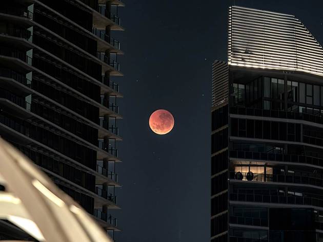 A large red moon over the Webb Bridge in Melbourne