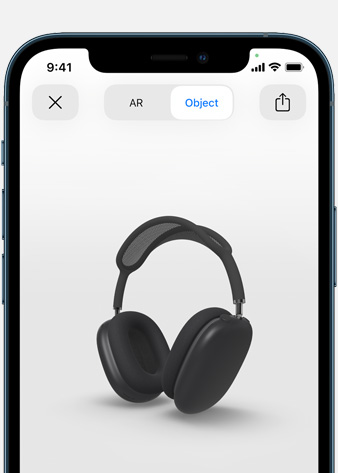 Slika na kojoj se prikazuju svemirski sive AirPods Max slušalice na zaslonu Proširena stvarnost na iPhone uređaju.