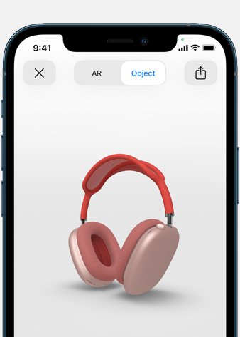 Gambar memperlihatkan AirPods Max Merah Muda dalam Augmented Reality pada layar iPhone.