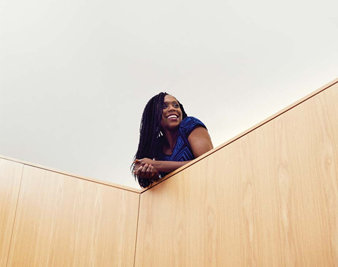 An Apple employee smiling