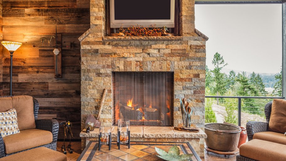 Brown, stone fireplace as focal point of living room