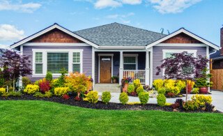 House with small bushes in front yard