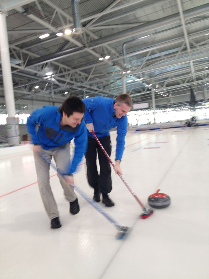 Employees curling during team building
