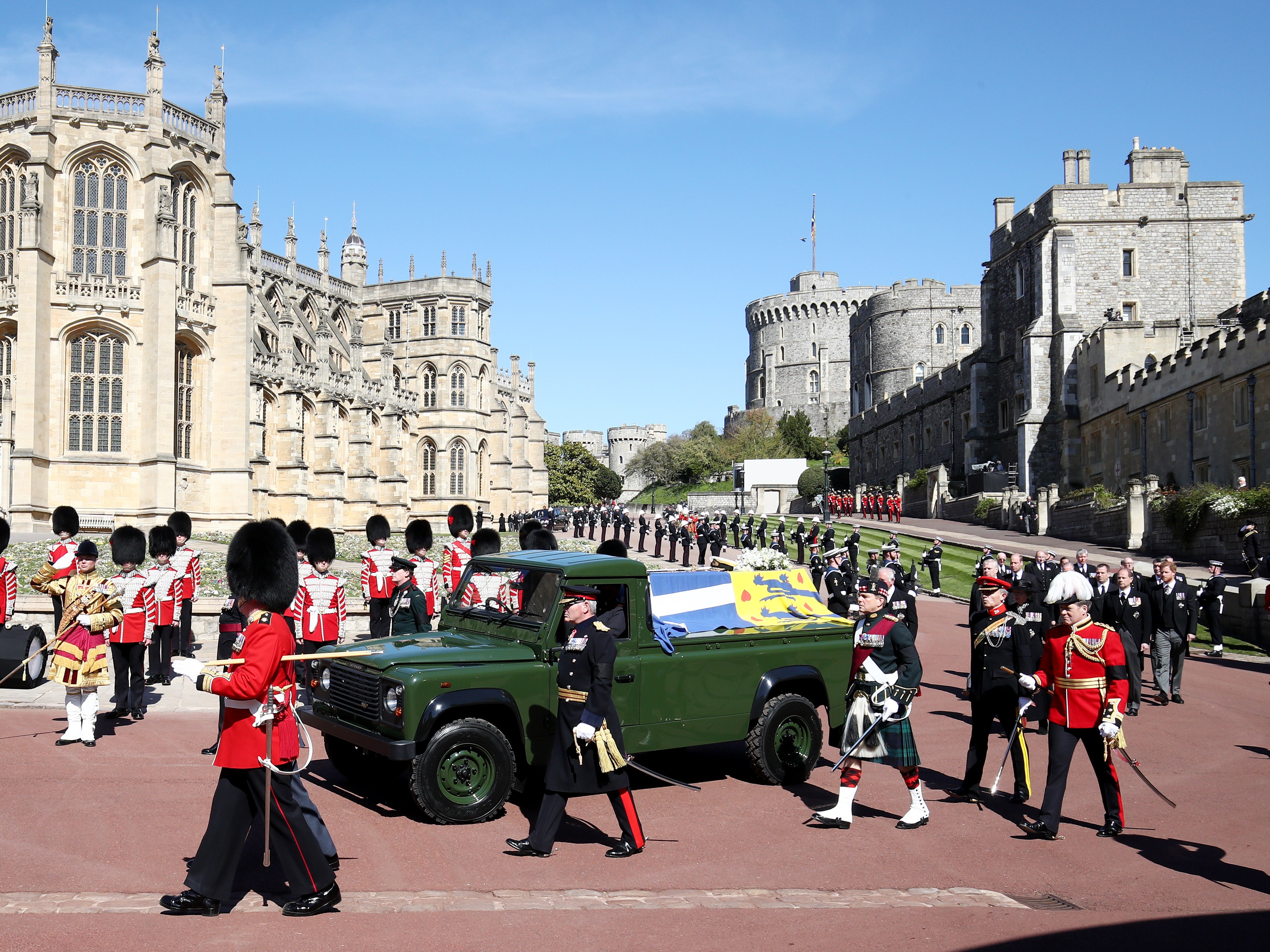 The Duke of Edinburghs coffin covered with His Royal Highnesss Personal Standard is carried on the purpose built Land...